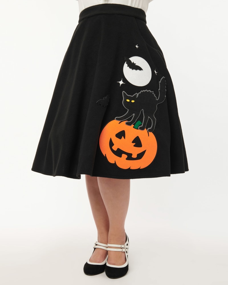 Front of a model wearing a size 5X Unique Vintage Black Halloween Music Box Soda Shop Swing Skirt in Black by Unique Vintage. | dia_product_style_image_id:302418